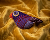 Purple finch felt brooch with orange beak