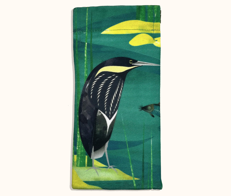 Canvas glasses slip case featuring a stylised black bittern standing on a rock in a stream.