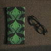Canvas glasses slip case featuring a silhouette of facing dancing brolgas in an art nouveau inspired pattern in forest green