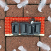Canvas glasses slip case featuring a white ibis poking its head up behind four metal rubbish bins lined up against a red brick wall.