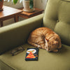 Canvas glasses slip case with a stylised orange stripey cat on a black background with a large white full moon behind its head.