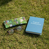 Canvas glasses slip case featuring hand drawn tropical style houses surrounded by lawns and tropical trees.