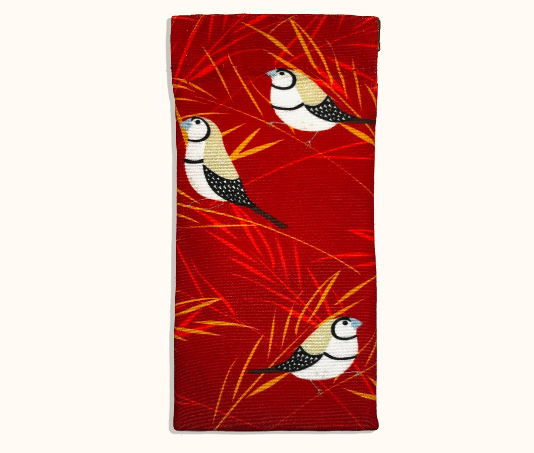 Canvas glasses slip case with stylised double barred finches with red and gold grasses on a red background