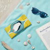 Canvas glasses slip case featuring a stylised fairy penguin within a blue and yellow ogee pattern