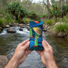 Canvas glasses slip case featuring a stylised Nankeen night heron standing on a rock in a stream with water flowing around it.