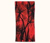 A canvas glasses slip case with a black and red pattern of pandanus trees covering it.
