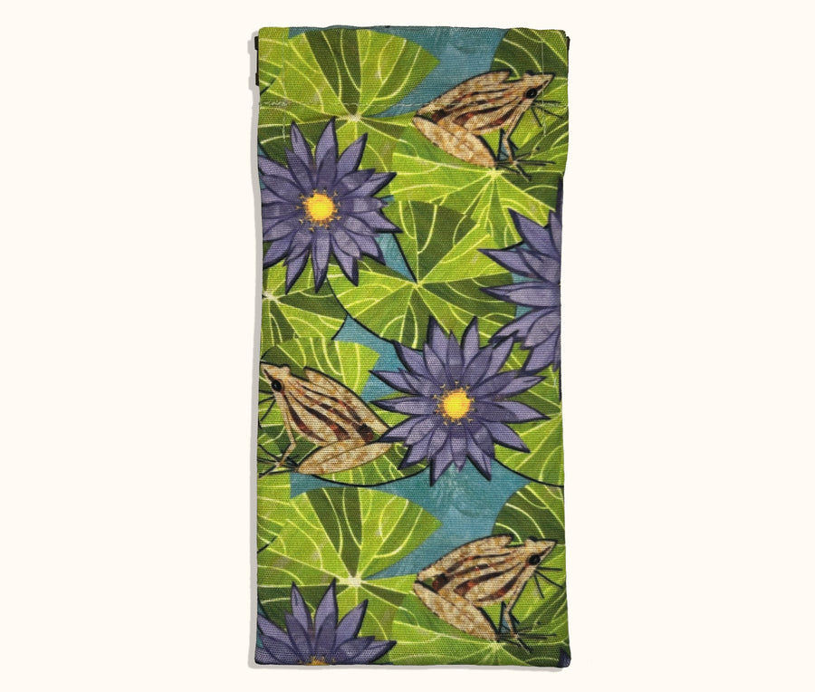 Canvas glasses slip case featuring a pattern of striped rocket frogs on waterlily pads with purple waterlily  flowers