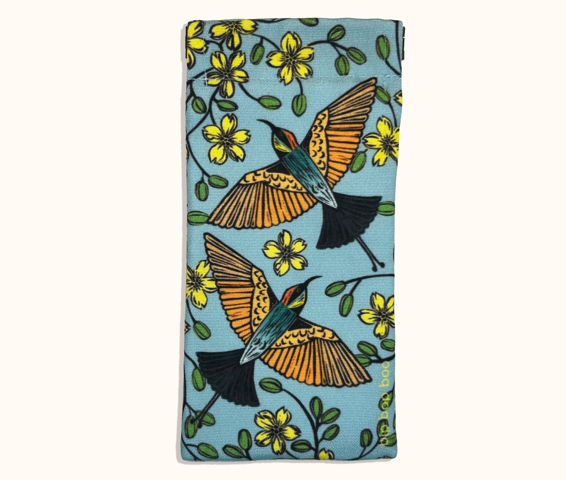 A canvas glasses slip case featuring coloured lino prints of two rainbow bee-eaters surrounded by kapok flowers