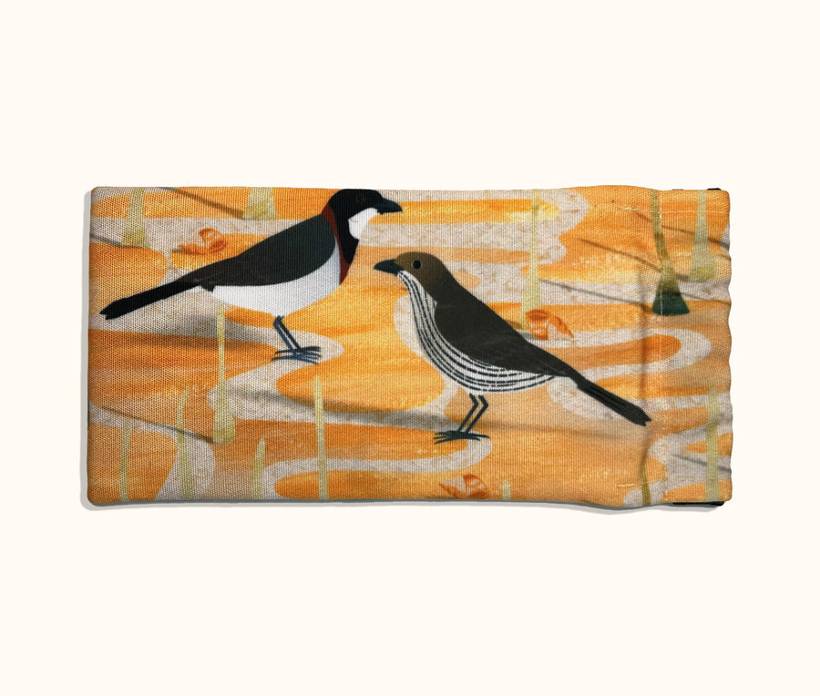 Canvas glasses slip case showing a stylised male and female white-breasted whistler on a mangrove flat