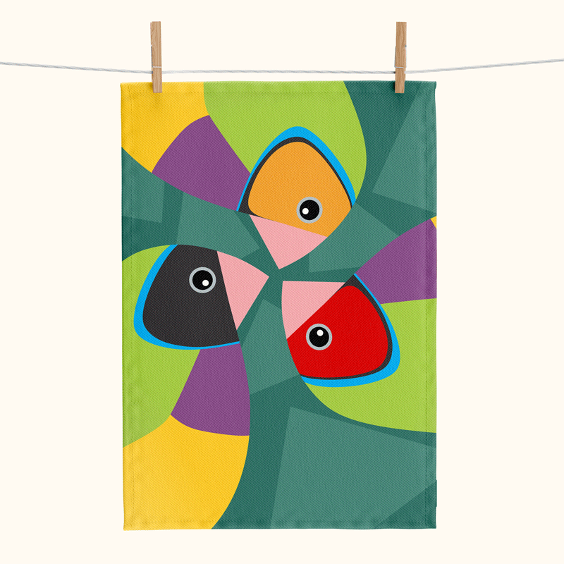 bright linen tea towel with three large stylised Gouldian finches against a green background