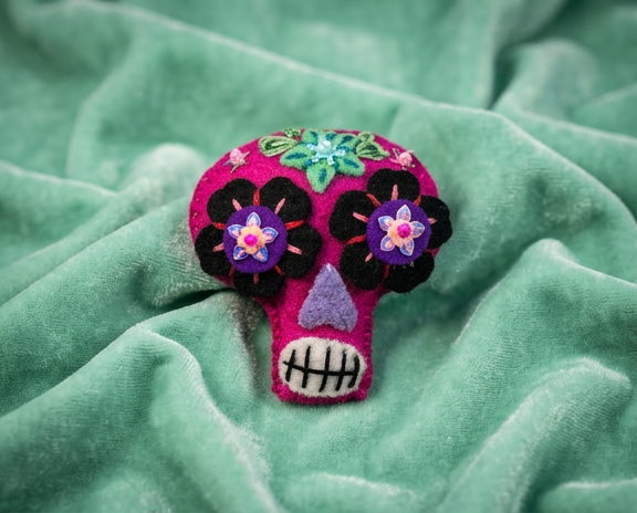 Hot pink sugar skull brooch with black and purple flower eyes