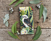Canvas glasses slip case featuring a laughing kookaburra in a flowering river red gum on a rustic timber backdrop surrounded by gum leaves and gumnuts