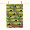 a linen tea towel with a pattern of comb-crested jacanas, sacred lotus flowers and lilypads