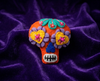 Orange sugar skull felt brooch with purple flowers and yellow hearts for eyes