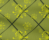 Green fabric with yellow starburst pattern and black diagonal lines