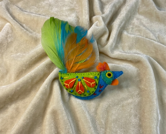 lime green, blue and orange rooster felt brooch, with a feather tail