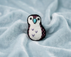 Black, white and pink penguin felt brooch with a blue beak