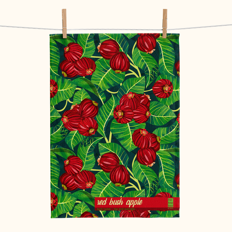 linen tea towel featuring a red bush apple pattern