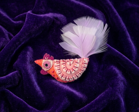Pink felt rooster brooch with feather tail