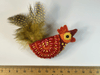 orange and red felt rooster brooch with yellow and black spotty tail feathers