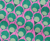 Fabric with pattern of abstract lily pads on a pink background