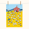a tea towel showing a beach scene of cartoon birds engaged in festival activities