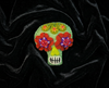 Mint green sugar skull felt brooch with red and purple flower eyes