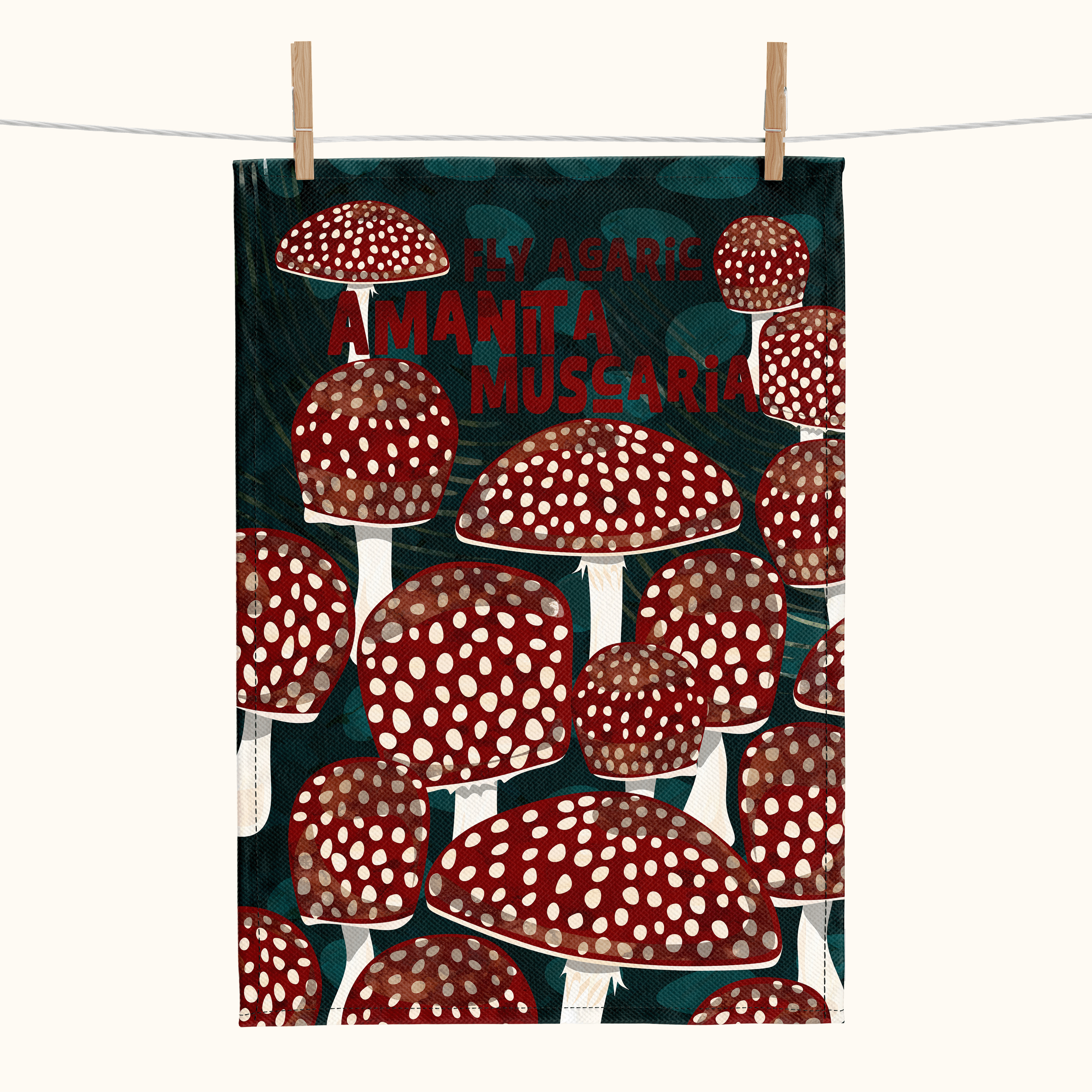 linen tea towel showing red and white spotted mushrooms