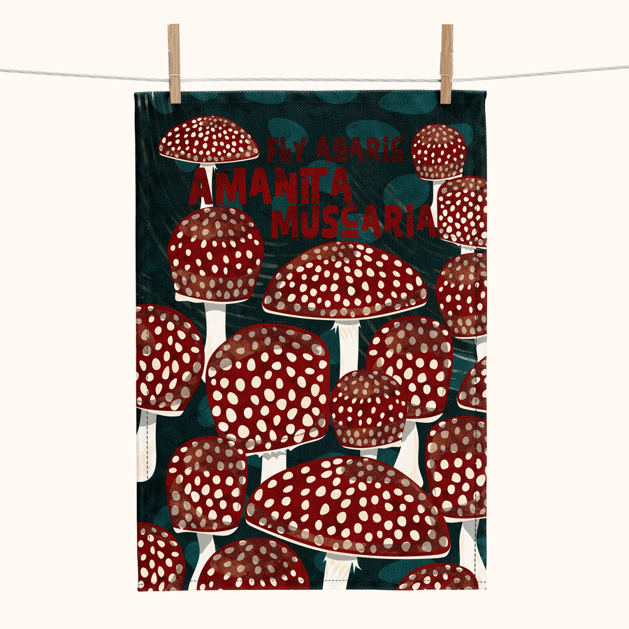 linen tea towel showing red and white spotted mushrooms