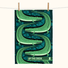 a linen tea towel featuring a stylised pattern of saltwater crocodiles
